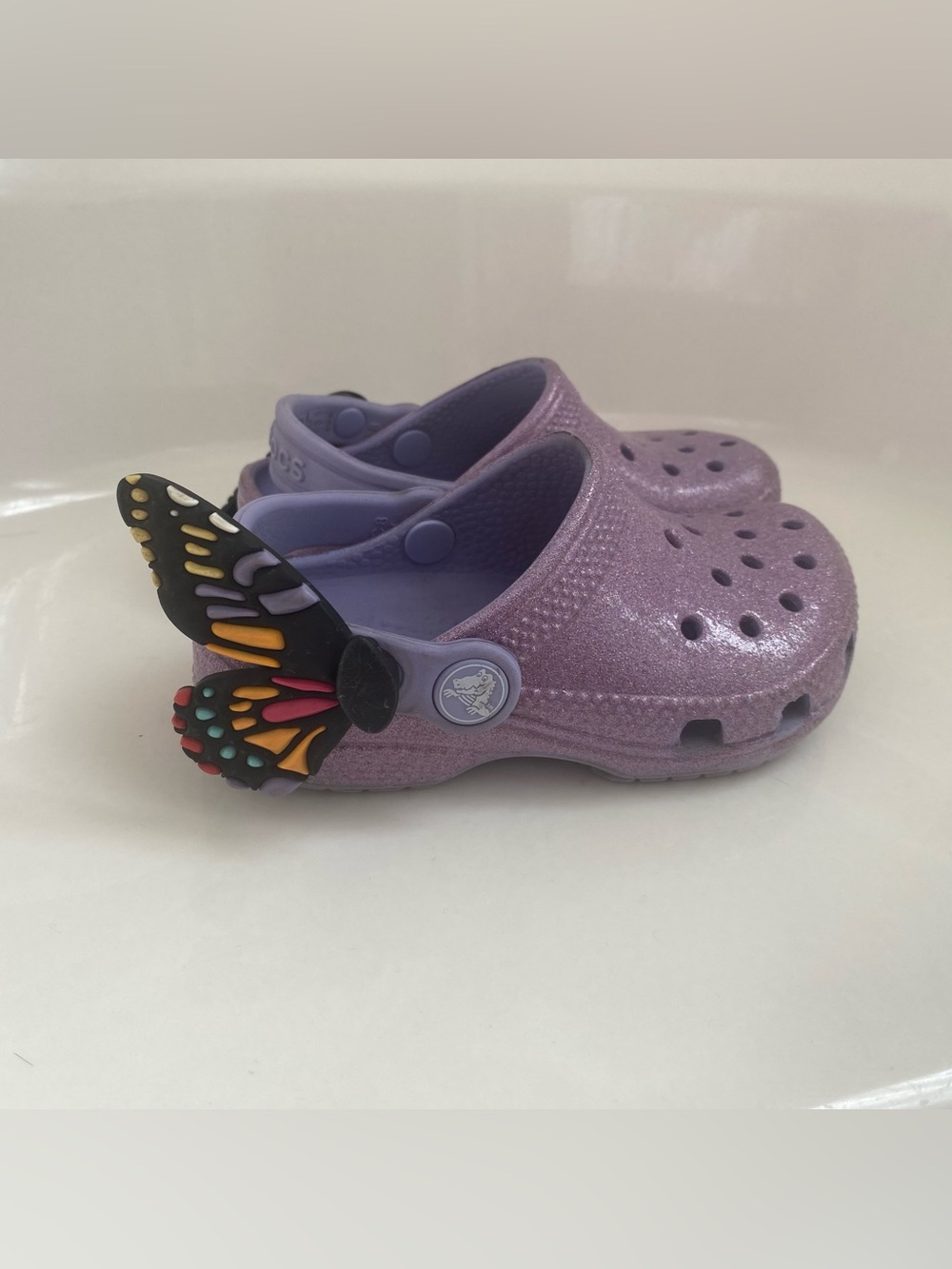 Purple glitter Crocs with butterfly strap, toddler size 8